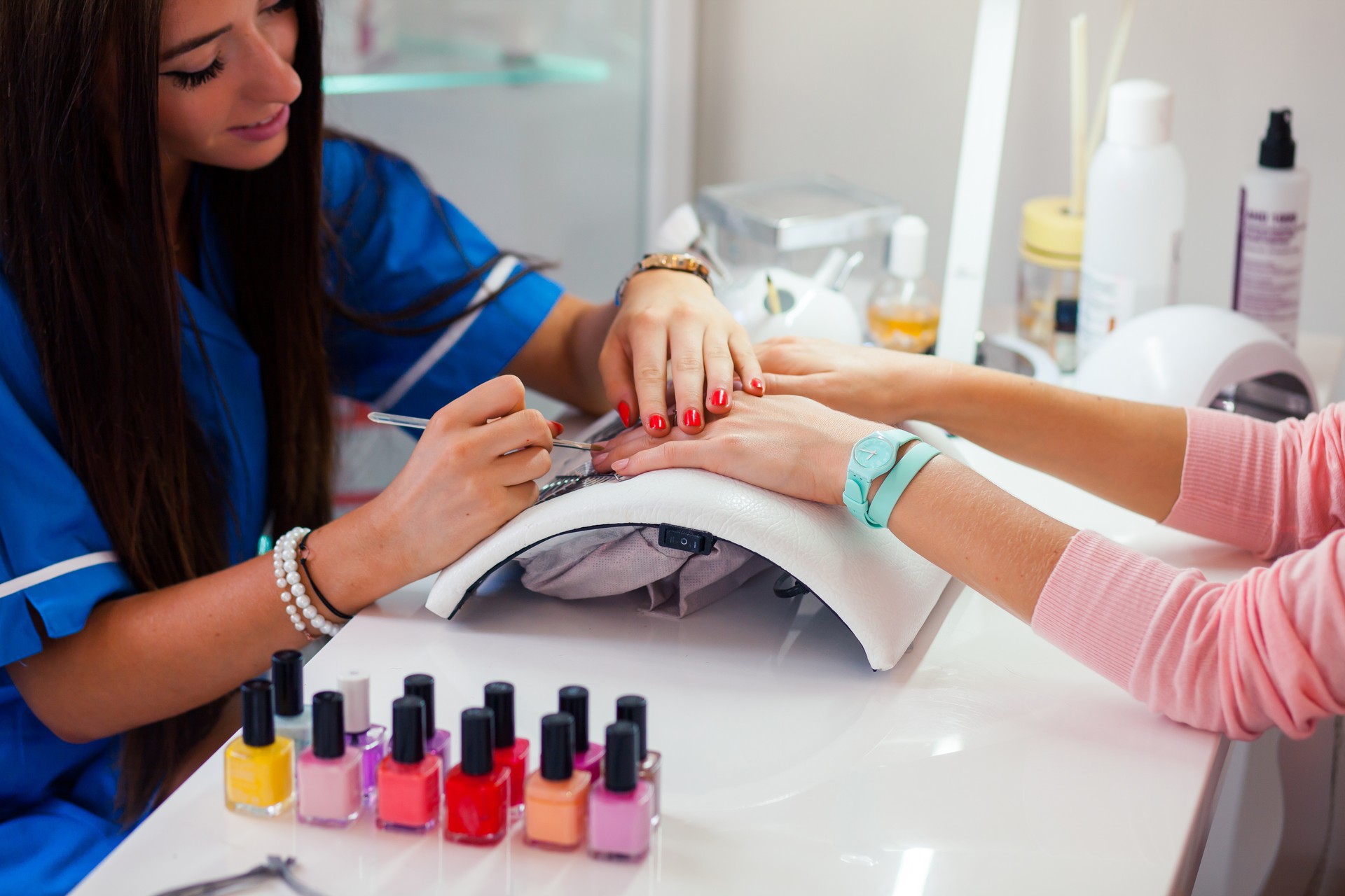 Woman hand on manicure treatment in beauty salon.